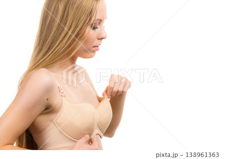 Woman wearing too big bra 138961363