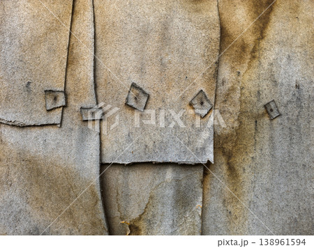 Close-up of textured layered fiberboard wall with visible overlaps 138961594