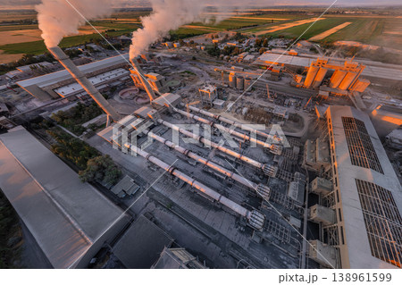 Industrial cement plant with smokestacks from above 138961599