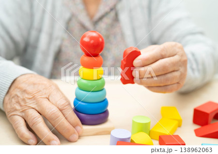 Asian elderly woman playing game. Asian elderly woman playing game. 138962063