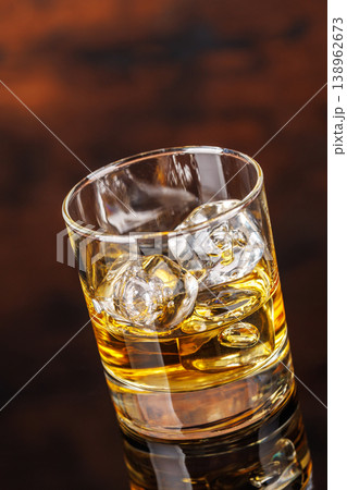 Glass of whiskey with ice 138962673