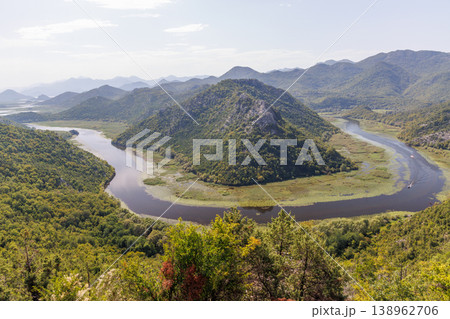 Winding river canyon with green mountains aerial view Winding river canyon with green mountains aerial view 138962706