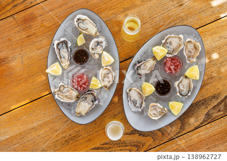 Fresh oysters on ice with champagne Fresh oysters on ice with champagne 138962727