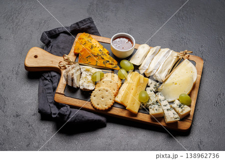 Cheese board with olives grapes and honey Cheese board with olives grapes and honey 138962736