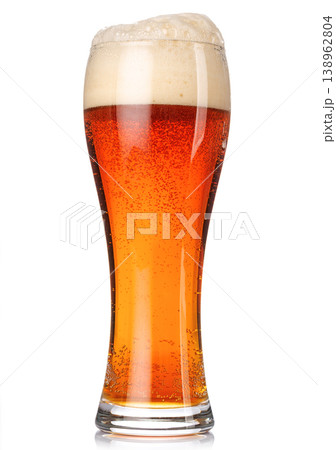 A glass of beer with amber hue and frothy head, isolated on a clean white background A glass of beer with amber hue and frothy head, isolated on a clean white background 138962804