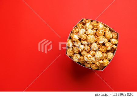 Popcorn bucket on bright red background Popcorn bucket on bright red background 138962820