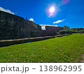 Scenic view of old stone fortifications and a hiking trail on a moody overcast day. 138962995