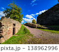 Scenic view of old stone fortifications and a hiking trail on a moody overcast day. 138962996