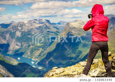 Tourist taking photo from Dalsnibba viewpoint Norway Tourist taking photo from Dalsnibba viewpoint Norway 138963349