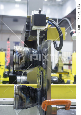 Wire-cut electrical discharge machine. Operation of wire-EDM machine cutting metal parts. Electrical discharge machine EDM cutting metal workpiece. Cutting process by wire cut machine. Metalworking 138964513