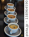 Row of espresso cups with crema and shallow focus, ideal for cafe, beverage, and coffee lifestyle themes 138964590