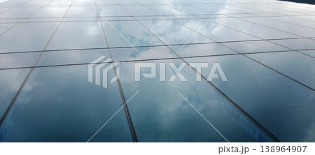 Sky mirror on a glass wall 138964907