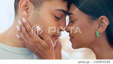 Face, love and relax with a couple closeup in their apartment together for care, romance or bonding. Trust, support or commitment with a happy young man and woman in their home on the weekend Face, love and relax with a couple closeup in their apartment together for care, romance or bonding. Trust, support or commitment with a happy young man and woman in their home on the weekend 138965036