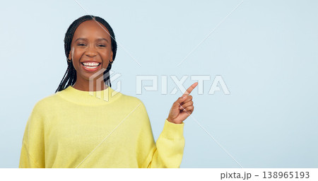 Pointing, smile and black woman with opportunity, portrait and announcement on a blue studio background. African person, model or girl with hand gesture, mockup space and choice with decision or news Pointing, smile and black woman with opportunity, portrait and announcement on a blue studio background. African person, model or girl with hand gesture, mockup space and choice with decision or news 138965193