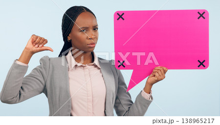 Portrait, speech bubble and mockup with a business black woman pointing in studio on a gray background. Review, information or announcement and a young employee holding space with tracking markers Portrait, speech bubble and mockup with a business black woman pointing in studio on a gray background. Review, information or announcement and a young employee holding space with tracking markers 138965217
