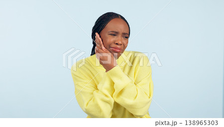 Black woman, toothache and inflammation with pain, unhappy and uncomfortable on isolated studio background. Dental problem, teeth and mouth for cavity, sore and pressure with hands, gums or infection 138965303