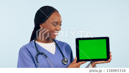 Green screen, doctor and woman with tablet for telehealth, clinic promotion and medical news. Healthcare, mockup and person on digital technology for website, research and online consulting in studio 138965316