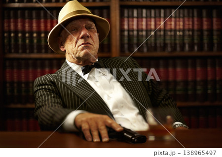 Man, mafia and boss or gun serious face for crime gangster, whiskey in office. Male person, hitman and portrait of killer for weapon pistol or danger violence for spy interrogation, business or power Man, mafia and boss or gun serious face for crime gangster, whiskey in office. Male person, hitman and portrait of killer for weapon pistol or danger violence for spy interrogation, business or power 138965497