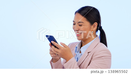 Business, woman and phone in studio for search, networking and planning with happy expression on blue background. Person, smartphone or technology for scrolling on social media or website on mock up Business, woman and phone in studio for search, networking and planning with happy expression on blue background. Person, smartphone or technology for scrolling on social media or website on mock up 138965502
