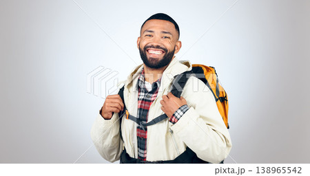 Man, portrait and hiking in studio with backpack and smile from travel and freedom with adventure. Camping, fitness and grey background and walking with trekking camper gear for vacation and holiday Man, portrait and hiking in studio with backpack and smile from travel and freedom with adventure. Camping, fitness and grey background and walking with trekking camper gear for vacation and holiday 138965542