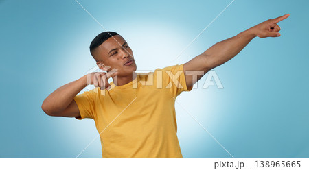 Pointing, announcement or man by offer, discount deal or sale on studio space or advertising. Breaking news, show or male person with mockup for guide, menu choice or promotion on blue background Pointing, announcement or man by offer, discount deal or sale on studio space or advertising. Breaking news, show or male person with mockup for guide, menu choice or promotion on blue background 138965665