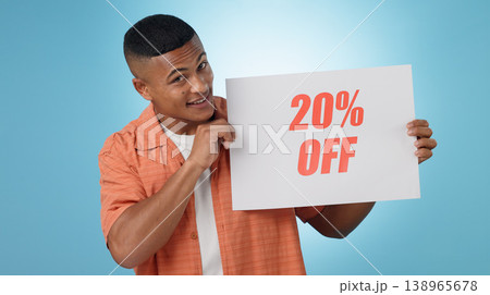 Portrait, man and poster for sale in studio with mock up for discount on blue background. Cape Town, male model and smile with announcement, promotion and sign on board with presentation in space Portrait, man and poster for sale in studio with mock up for discount on blue background. Cape Town, male model and smile with announcement, promotion and sign on board with presentation in space 138965678
