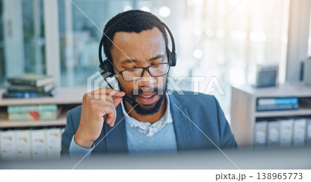 Computer, call center and support with a black man consultant working in customer service for assistance. Contact, crm and headset communication with an employee consulting in an office for sales 138965773