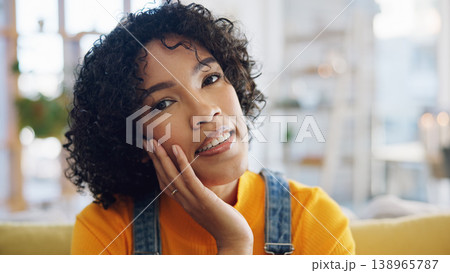 Face, smile and relax with a woman in the living room of her home looking happy on the weekend. Portrait, mindset or freedom with a young person in her apartment to enjoy peace and quiet alone Face, smile and relax with a woman in the living room of her home looking happy on the weekend. Portrait, mindset or freedom with a young person in her apartment to enjoy peace and quiet alone 138965787