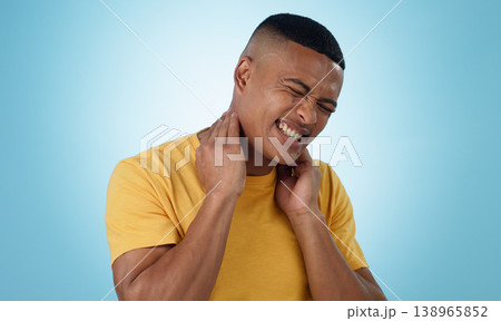 Neck pain, stress and man in studio with burnout, musical or joint crisis on blue background. Shoulder, injury and face of male model with anxiety for arthritis, fibromyalgia or osteoporosis tension 138965852