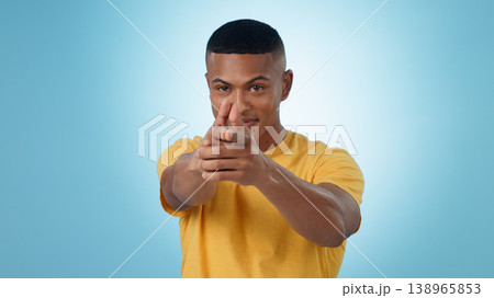 Portrait, finger gun and man aim at target in studio isolated on a blue background mockup space. Face, shooting hand gesture or African person pointing pistol weapon for self defence to kill criminal Portrait, finger gun and man aim at target in studio isolated on a blue background mockup space. Face, shooting hand gesture or African person pointing pistol weapon for self defence to kill criminal 138965853