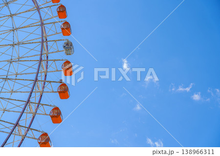 Osaka, Japan - Oct 11 2024, panoramic view from below of the Tempozan Ferris wheel against a blue sky, without people, in the daytime, Osaka, Japan Osaka, Japan - Oct 11 2024, panoramic view from below of the Tempozan Ferris wheel against a blue sky, without people, in the daytime, Osaka, Japan 138966311