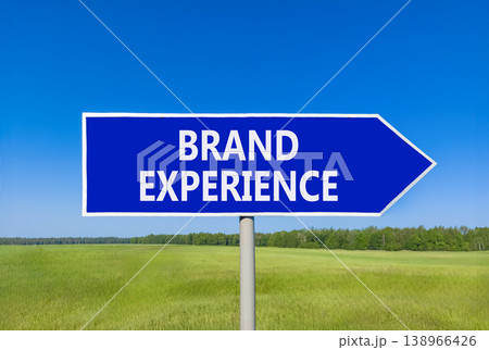 Brand experience symbol. Concept words Brand experience on beautiful blue road sign. Beautiful blue sky green grass field background. Business branding and brand experience concept. Copy space. 138966426