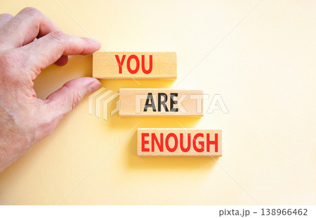 You are enough words symbol. Concept words You are enough on beautiful wooden blocks. Beautiful white background. Businessman hand. Business motivational and you are enough concept. Copy space. You are enough words symbol. Concept words You are enough on beautiful wooden blocks. Beautiful white background. Businessman hand. Business motivational and you are enough concept. Copy space. 138966462