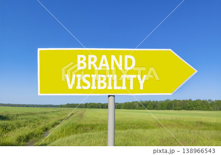 Brand visibility symbol. Concept words Brand visibility on beautiful yellow road sign. Beautiful blue sky green grass field background. Business branding and brand visibility concept. Copy space. 138966543