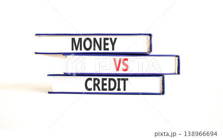 Money vs credit words symbol. Concept words Money vs credit on beautiful books. Beautiful white table white background. Business and money vs credit concept. Copy space. Money vs credit words symbol. Concept words Money vs credit on beautiful books. Beautiful white table white background. Business and money vs credit concept. Copy space. 138966694