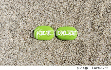 Medicare enrollment words symbol. Concept words Medicare enrollment on beautiful green stones. Beautiful sand background. Medical and Medicare enrollment words concept. Copy space. Medicare enrollment words symbol. Concept words Medicare enrollment on beautiful green stones. Beautiful sand background. Medical and Medicare enrollment words concept. Copy space. 138966766