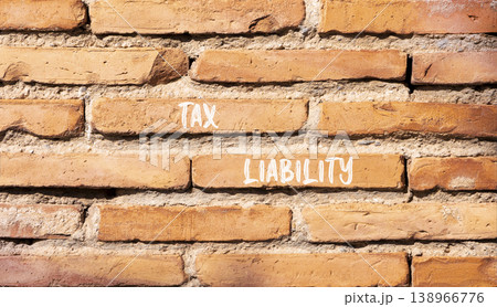 Tax liability words symbol. Concept words Tax liability on beautiful brick wall. Beautiful brick wall background. Business and Tax liability words concept. Copy space. Tax liability words symbol. Concept words Tax liability on beautiful brick wall. Beautiful brick wall background. Business and Tax liability words concept. Copy space. 138966776