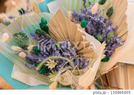 Close up: beautiful bouquets of purple lavender flowers in craft paper cornets 138966805
