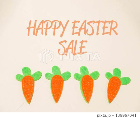 Group of carrots are displayed with a sign that says Happy Easter Sale 138967041