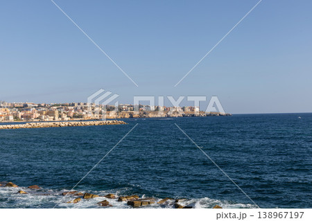 Syracuse skyline along sunlit Mediterranean seaside promenade 138967197