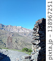 Ruins of the Kurta and Taga signal tower, North Ossetia, Russia. Crumbling stone walls of an ancient Alan watchtower on a green mountain slope 138967251