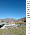 View of the village of Hidikus, Kurtatinsky Gorge, North Ossetia, Russia, bright summer day. Small mountain settlement with traditional stone houses scattered along a green valley floor 138967252