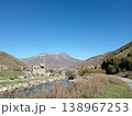 Bright summer day view of Hidikus village, Kurtatinsky Gorge, North Ossetia, Russia. Secluded settlement nestled in a mountain valley with green meadows and rocky peaks 138967253