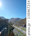 Alan Monastery stone complex, North Ossetia, Russia, summer daylight. Traditional Ossetian monastery built of stone on a grassy mountain slope 138967254