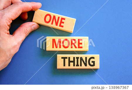 One more thing words symbol. Concept words One more thing on beautiful wooden blocks. Beautiful blue background. Businessman hand. Business and one more thing concept. Copy space. One more thing words symbol. Concept words One more thing on beautiful wooden blocks. Beautiful blue background. Businessman hand. Business and one more thing concept. Copy space. 138967367