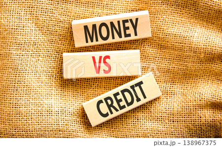 Money vs credit words symbol. Concept words Money vs credit on beautiful wooden blocks. Beautiful canvas background. Business and money vs credit concept. Copy space. Money vs credit words symbol. Concept words Money vs credit on beautiful wooden blocks. Beautiful canvas background. Business and money vs credit concept. Copy space. 138967375