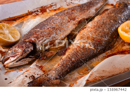 baked fish on a baking sheet, with spices and herbs, daylight, homemade, no people, 138967442
