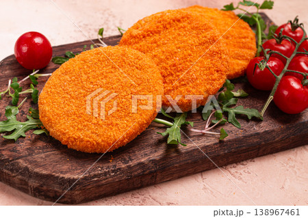 crispy fried fish cutlets, fish burgers, on a wooden chopping board, with arugula and cherry tomatoes, homemade, no people, crispy fried fish cutlets, fish burgers, on a wooden chopping board, with arugula and cherry tomatoes, homemade, no people, 138967461