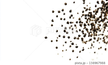 Black peppercorns flying isolated on a white background Black peppercorns flying isolated on a white background 138967988