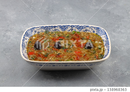 Traditional Turkish Roasted Eggplant Salad Meze with Garlic and Olive Oil on a Rustic Plate Backdrop 138968363